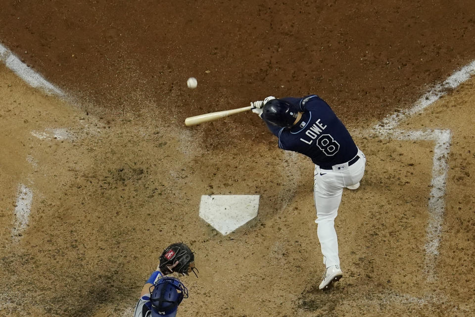 Tampa Bay Rays' Brandon Lowe hits a three-run home run against the Los Angeles Dodgers during the sixth inning in Game 4 of the baseball World Series Saturday, Oct. 24, 2020, in Arlington, Texas. (AP Photo/David J. Phillip)