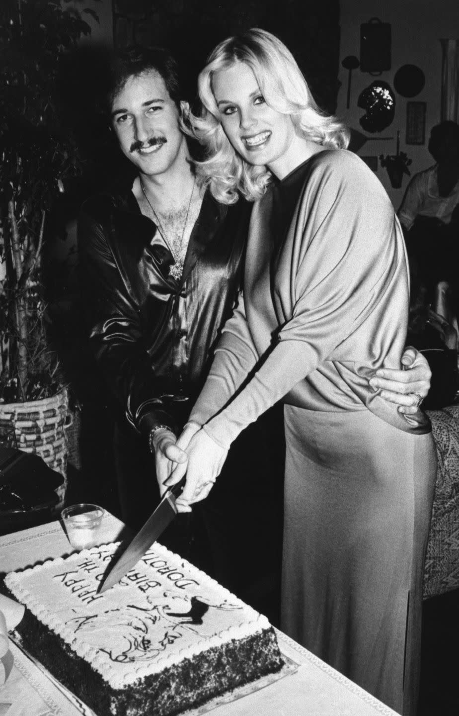 model dorothy stratten and husband cut birthday cake