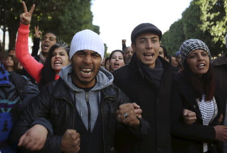 Unemployed graduates shout slogans during a demonstration to demand the government provide them with job opportunities, on Habib Bourguiba Avenue in Tunis, Tunisia January 20, 2016. REUTERS/Zoubeir Souissi