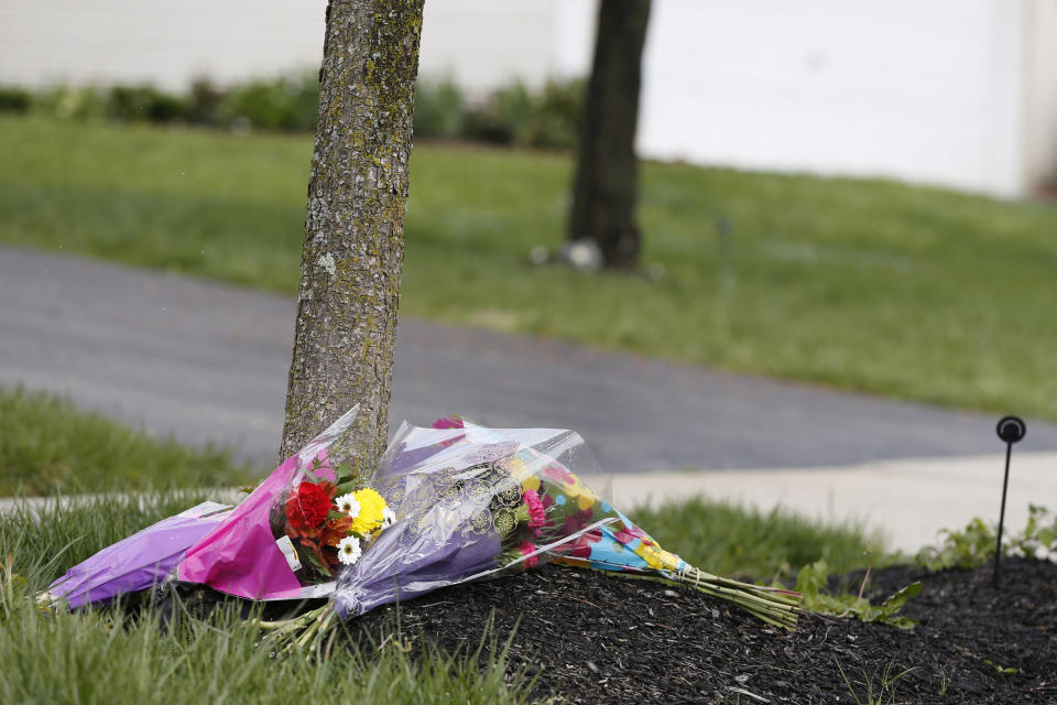 Flowers lay in a makeshift memorial in the neighborhood where a Columbus police officer fatally shot a teenage girl Wednesday, April 21, 2021, in Columbus, Ohio. (AP Photo/Jay LaPrete)