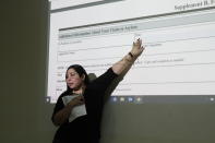 In this Nov. 15, 2019, photo, Crystal Sandoval, of El Paso, Texas-based Las Americas Immigrant Advocacy Center, gives an asylum application workshop in Ciudad Juarez, Mexico. The attendants, mostly from Cuba, were sent to Mexico by U.S. immigration officials to wait while they apply for asylum. Living in Mexico makes it harder for them to find attorneys. (AP Photo/Cedar Attanasio)