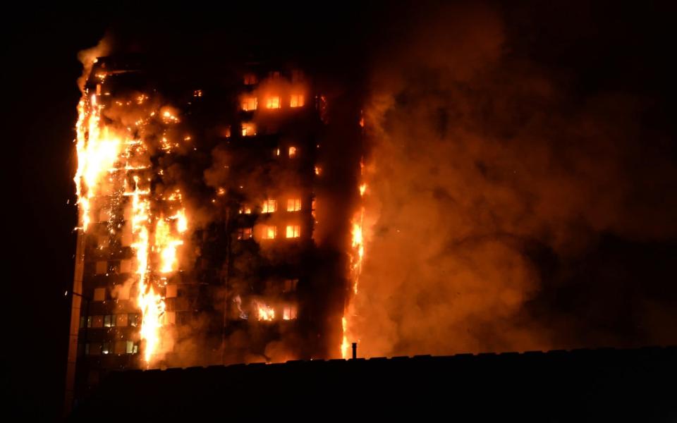 Flames engulf the block  - Credit: GIULIO THUBURN/AFP