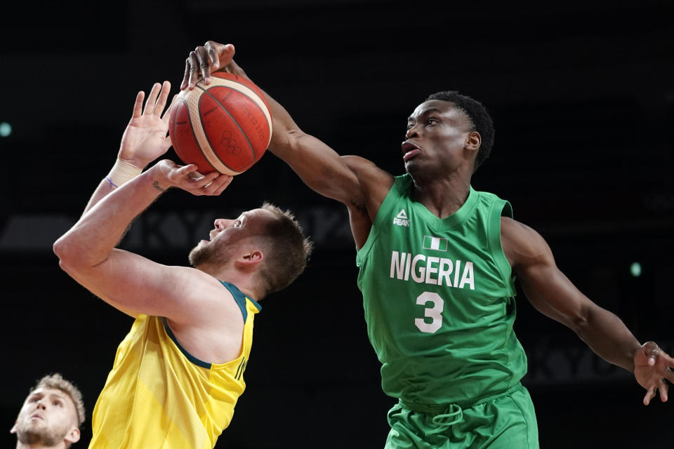 Nigeria's Caleb Agada (3) blocks a shot by Australia's Joe Ingles during a men's basketball preliminary round game at the 2020 Summer Olympics, Sunday, July 25, 2021, in Saitama, Japan. (AP Photo/Charlie Neibergall)