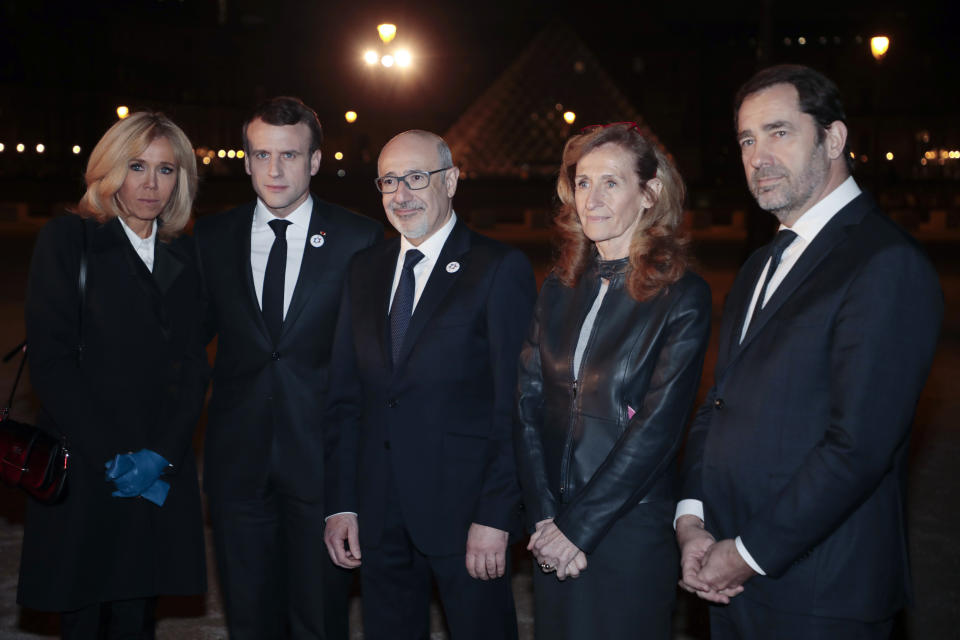 From left to right, wife of the French President Brigitte Macron, French President Emmanuel Macron, Conseil Representatif des Institutions Juives de France (CRIF) president Francis Kalifat, French Justice Minister Nicole Belloubet and French Interior Minister Christophe Castaner arrive at the Louvre Carrousel to attend the 34rd annual dinner of the group CRIF, Representative Council of Jewish Institutions of France, in Paris, Wednesday, Feb. 20, 2019. (Ludovic Marin, Pool Photo via AP)
