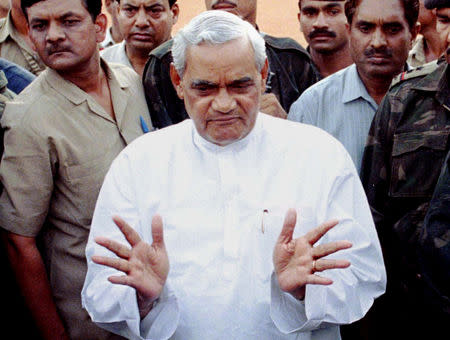 FILE PHOTO: Atal Bihari Vajpayee, the Hindu nationalist Bharatiya Janata Party's candidate for prime minister, gestures while talking to reporters at the Indian Presidential palace after meeting President Shankar Dayal Sharma in New Delhi, India May 10, 1996. REUTERS/Sunil Malhotra/File Photo