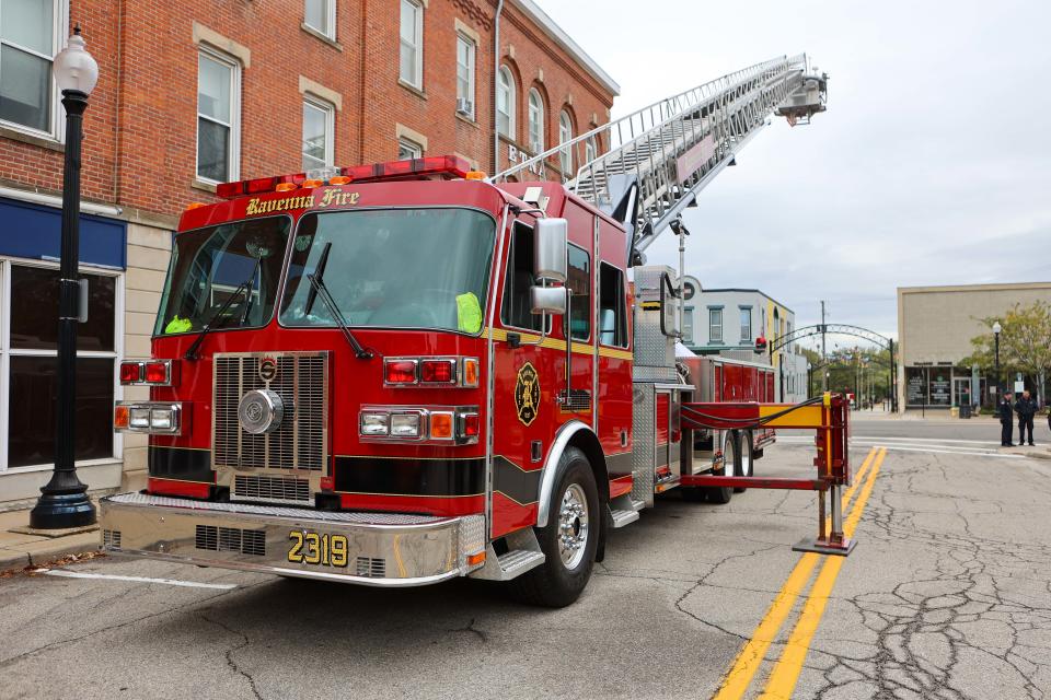 A Ravenna Fire Department ladder truck sets up on Park Way by the fire station as part of the grand opening celebration of the "Main Street Mile," a 1-mile loop of downtown Ravenna.