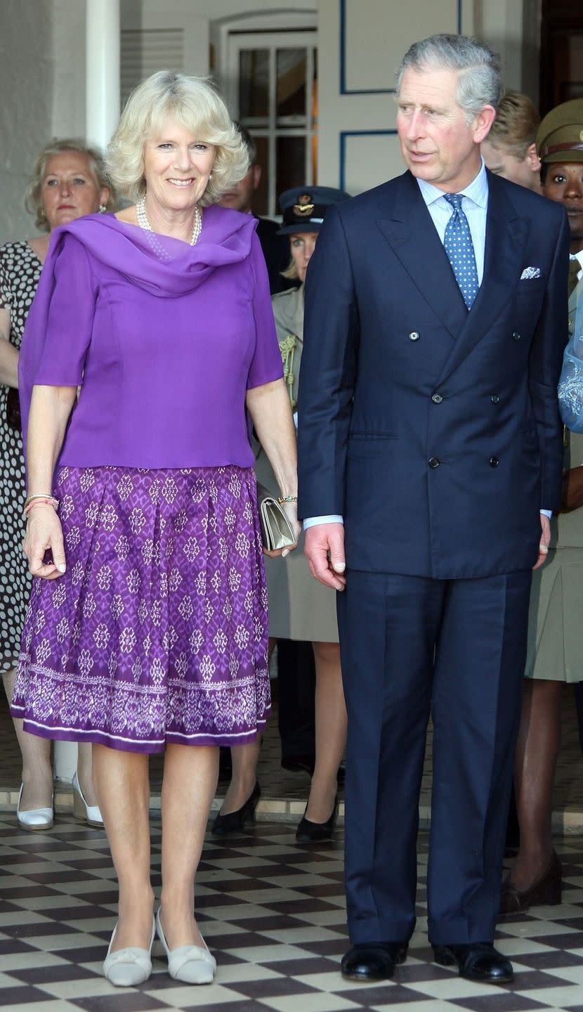 <p>In St. Lucia, as part of Charles and Camilla's Royal Tour of the Caribbean, Camilla donned this brilliant purple combo with a flowy, blousy top and a patterned skirt. </p>