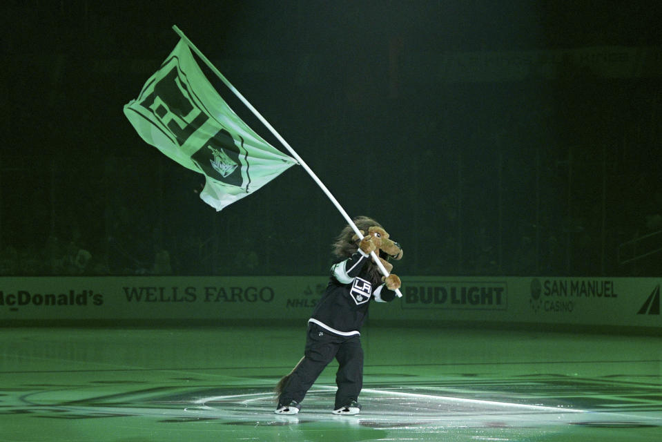 Los Angeles Kings mascot Bailey skates on the ice before an NHL hockey game against the San Jose Sharks, Monday, Nov. 25, 2019, in Los Angeles. (AP Photo/Michael Owen Baker)