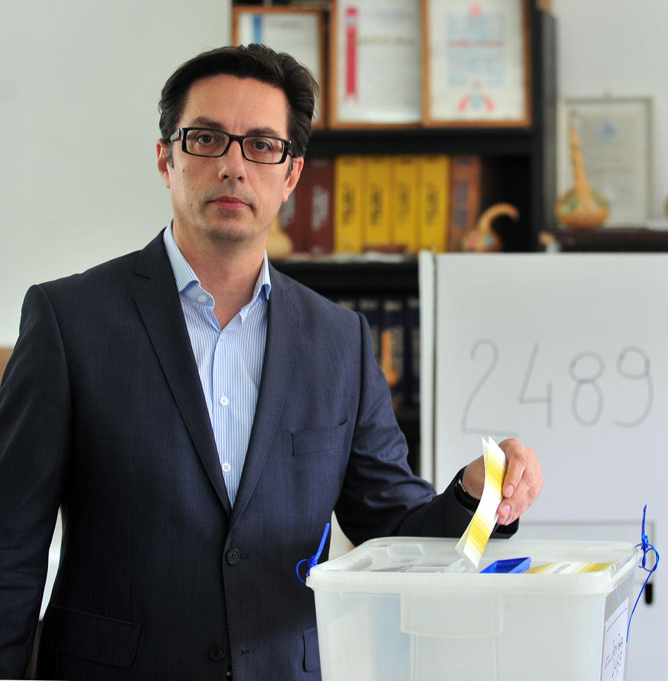 Stevo Pendarovski, presidential candidate supported by opposition social democrats, casts his ballot for double elections, in Skopje, Macedonia, on Sunday, April 27, 2014. Macedonia votes Sunday on presidential election runoff and snap parliamentary elections. (AP Photo/Vangel Tanurovski)