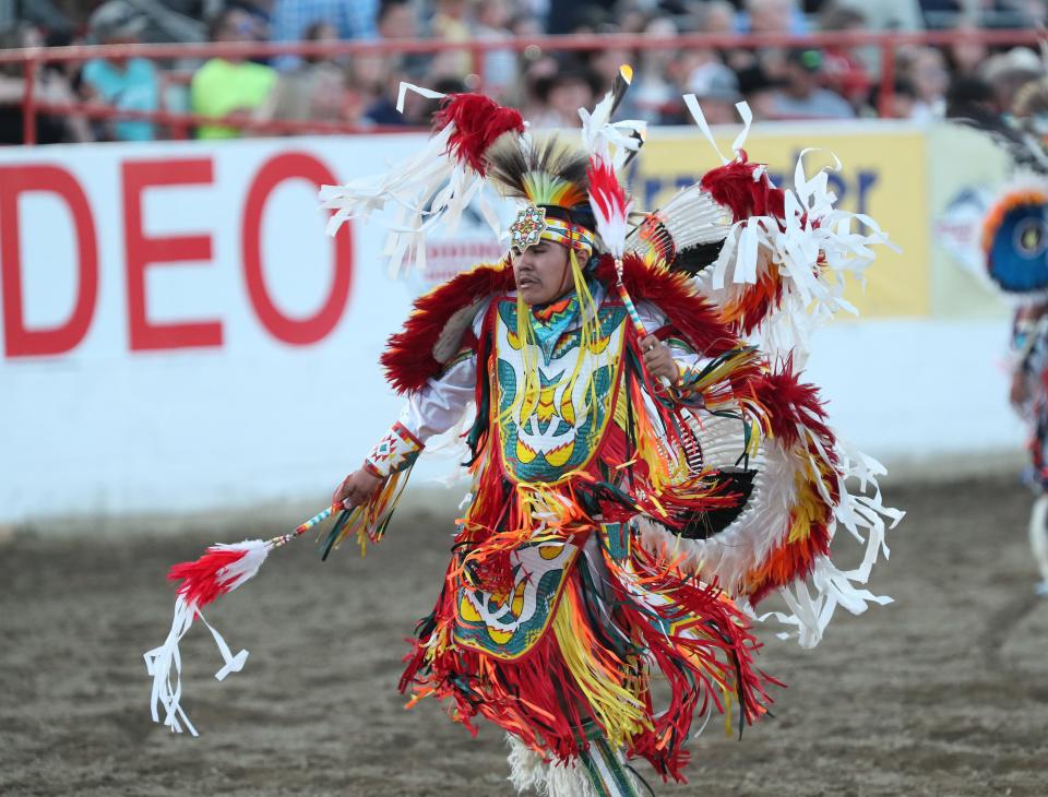 The Native American performs the Pow Wow dance in the rodeo arena on Wednesday evening./// The Extreme Bulls and Barrels kick off the 75th Annual Redding Rodeo on Wednesday May 17th. /// (Photo by Hung T. Vu/Special to the Record Searchlight)