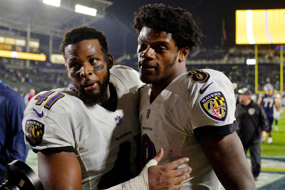 Baltimore Ravens quarterback Lamar Jackson (8) and defensive back Anthony Levine (41) celebrate a 22-10 win over the Los Angeles Chargers in 2018 at StubHub Center. Mandatory Credit: Jake Roth-USA TODAY Sports