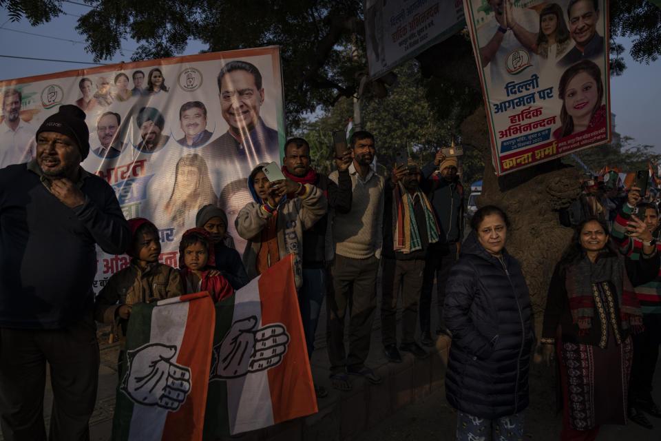 People watch from the sidewalks as Rahul Gandhi, leader of India's opposition Congress party, march with his supporters in New Delhi, India, Saturday, Dec. 24, 2022. Rahul Gandhi, leader of India's beleaguered opposition Congress party, on Saturday marched in New Delhi along with his supporters, part of his five-month-long 3,570km (2,218-mile) countrywide trek through 12 states that began 105 days ago.(AP Photo/Altaf Qadri)