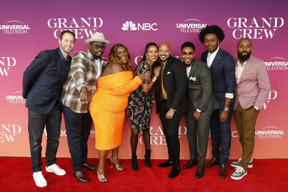 Cast and crew members of "Grand Crew" pose at the premiere of the show