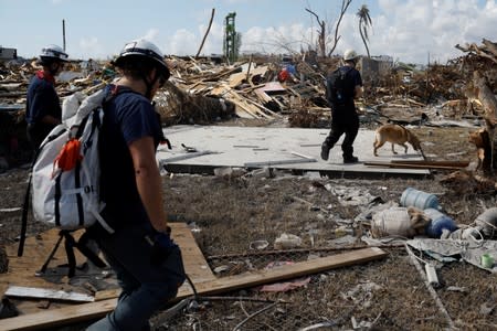 Personnel of the Canadian Burnaby Firefighters Search & Rescue Task Force search for the dead in the destroyed the Mudd neighbourhood after Hurricane Dorian hit the Abaco Islands in Marsh Harbour