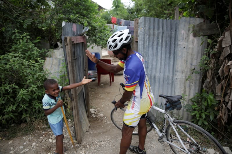 The Wider Image: Haiti's cyclists brave protests and poor roads in race for gold