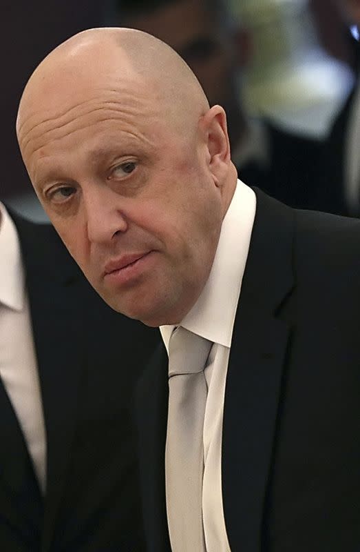 FILE PHOTO: Russian businessman Prigozhin looks on before a meeting at the Kremlin in Moscow