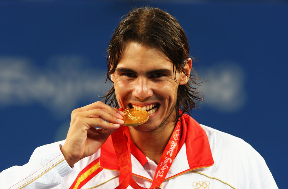 BEIJING - AUGUST 17: Rafael Nadal of Spain celebrates winning the gold medal against Fernando Gonzalez of Chile during the men's singles gold medal tennis match held at the Olympic Green Tennis Center during Day 9 of the Beijing 2008 Olympic Games on August 17, 2008 in Beijing, China. (Photo by Clive Brunskill/Getty Images)