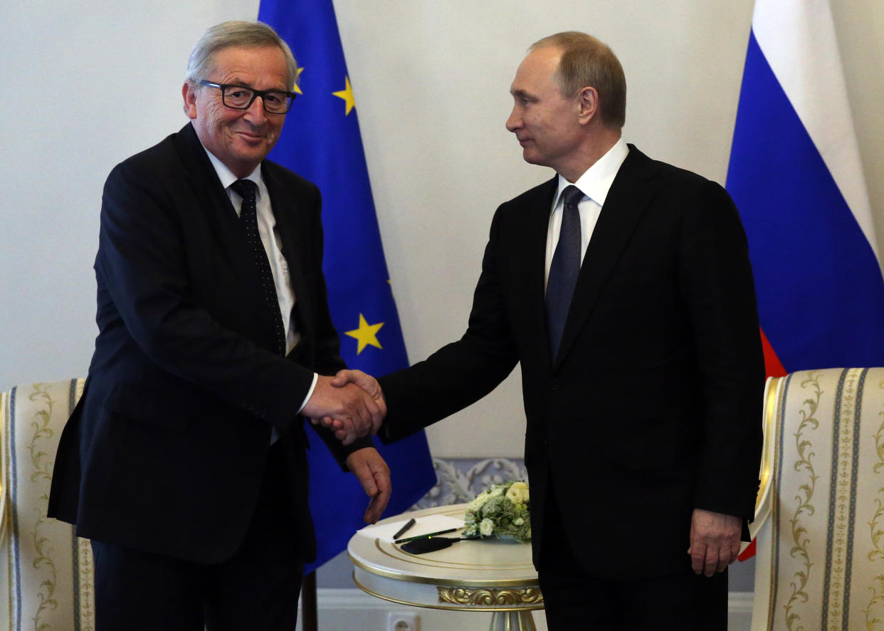 Jean-Claude Juncker and Vladimir Putin at a summit in Moscow last year (Getty)