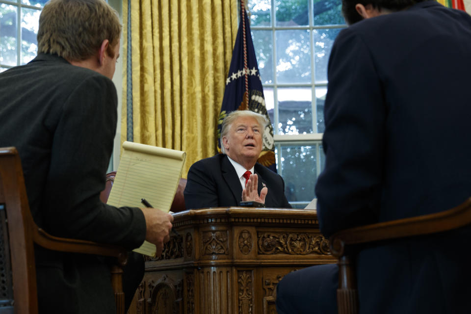 President Donald Trump speaks during an interview with The Associated Press in the Oval Office of the White House, Tuesday, Oct. 16, 2018, in Washington. (AP Photo/Evan Vucci)