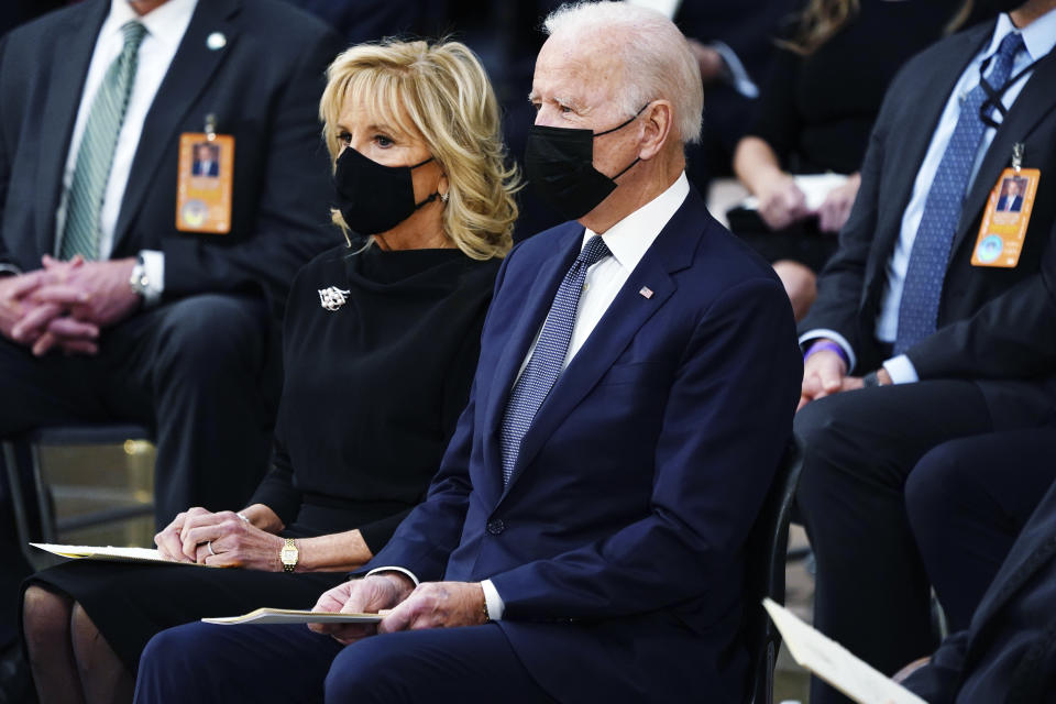 President Joe Biden and first lady Jill Biden, listen during a service for former Sen. Bob Dole of Kansas, as Dole lies in state in the Rotunda of the U.S. Capitol, Thursday, Dec. 9, 2021 in Washington. (Shawn Thew/Pool via AP)