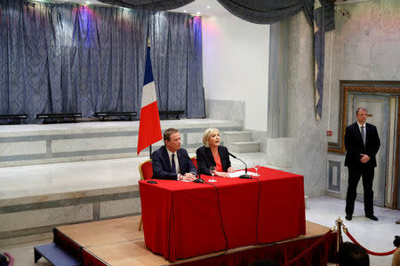 Marine Le Pen French National Front (FN) political party leader and candidate for French 2017 presidential election and Debout La France group former candidate Nicolas Dupont-Aignan attend a news conference in Paris, France, April 29, 2017. REUTERS/Charles Platiau