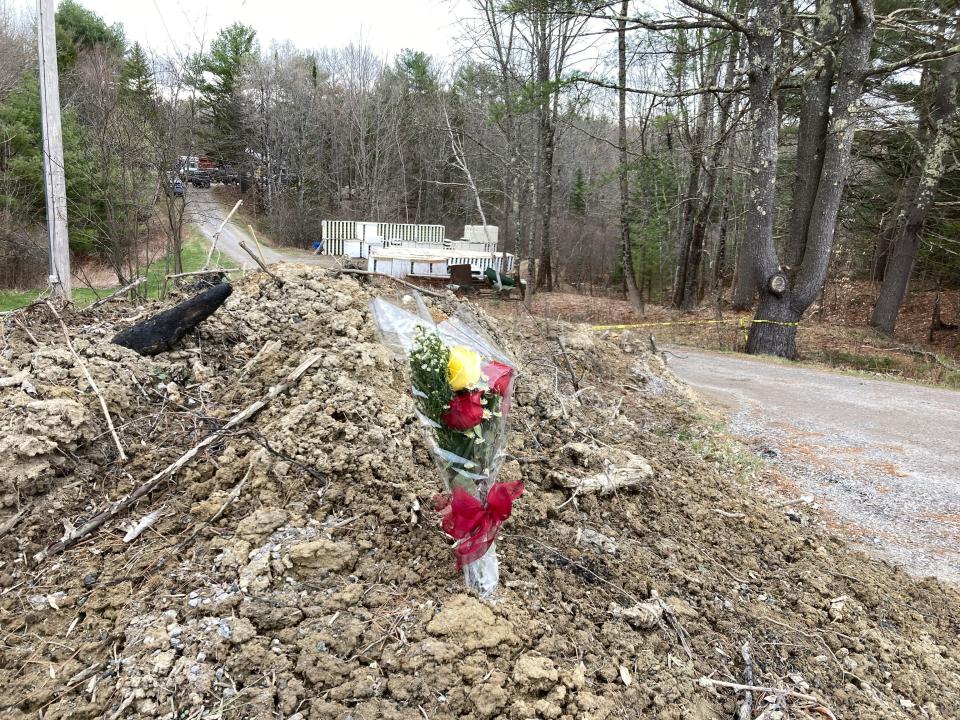 Mourners started assembling a makeshift memorial, Wednesday, April 19, 2023 at a Bowdoin, Maine, home where police say four people were killed. A Maine man who police say killed four people in a home and then shot three others randomly on a busy highway had been released days earlier from prison, a state official said Wednesday, and he posted on social media about the need for forgiveness.