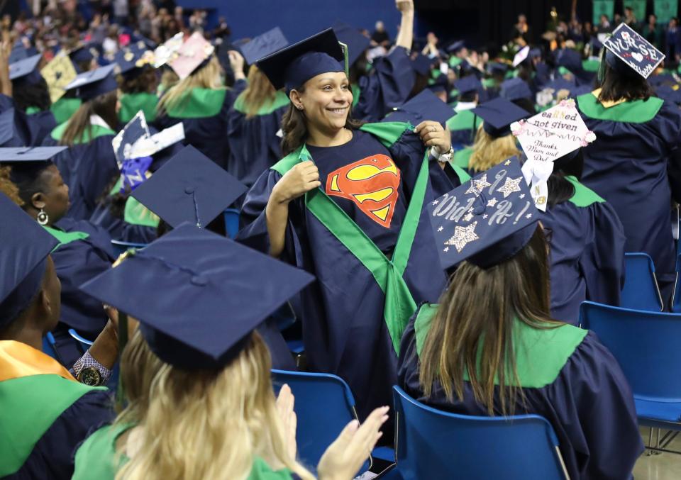 Beatrice Cruz shows off her superhero shirt after receiving her degree as Delaware Technical Community College Stanton and George (Wilmington) campuses graduate nearly 700 students at its 2019 annual commencement at the Bob Carpenter Center Wednesday, May 15, 2019.