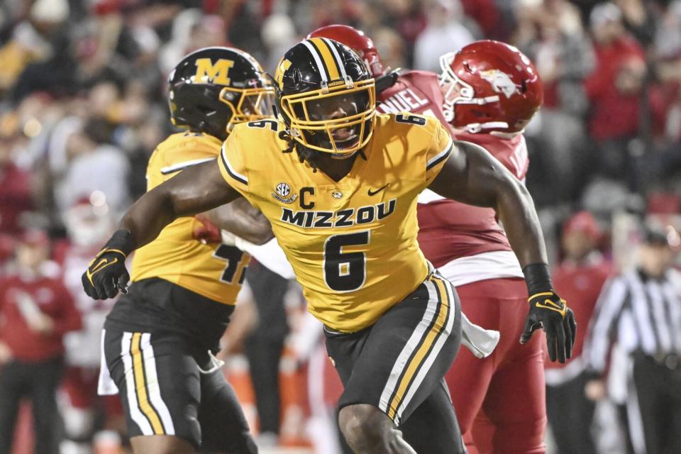 Missouri defensive lineman Darius Robinson pursues against Arkansas.