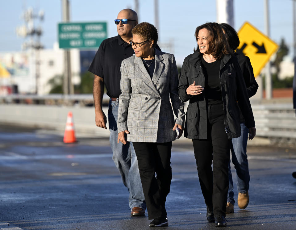 Vice President Kamala Harris, right, walks on I-10 with Los Angeles Mayor Karen Bass, Sunday, Nov. 19, 2023, to speak about the repairs to the I-10 underpass damaged by a fire on Saturday, Nov. 11, in Los Angeles. (AP Photo/Alex Gallardo)