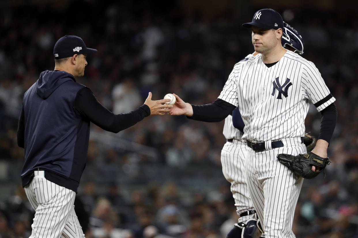 BRONX, NY - OCTOBER 15:  Manager Aaron Boone #17 of the New York Yankees takes the ball from Adam Ottavino #0 during a pitching change during Game 3 of the ALCS between the Houston Astros and the New York Yankees at Yankee Stadium on Tuesday, October 15, 2019 in the Bronx borough of New York City. (Photo by Rob Tringali/MLB Photos via Getty Images)