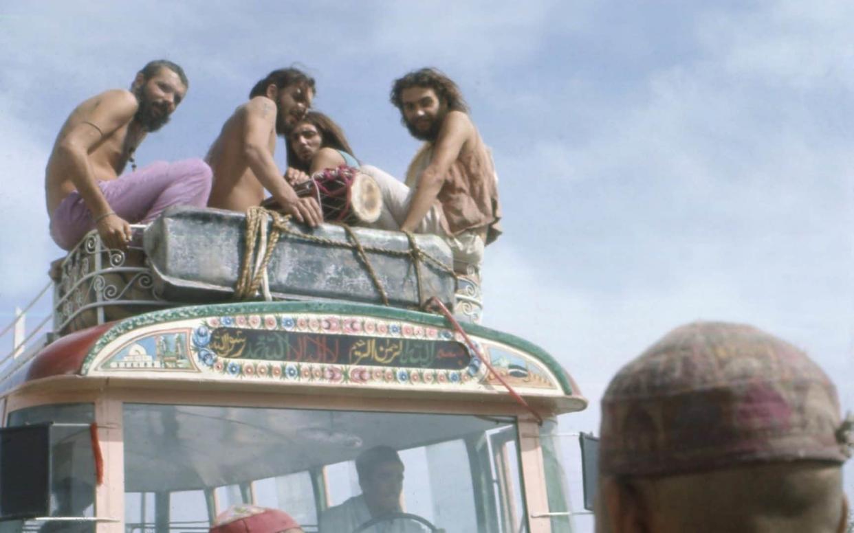 Getting high: hippies on top of a bus in Kabul in 1971 - Garofalo Jack