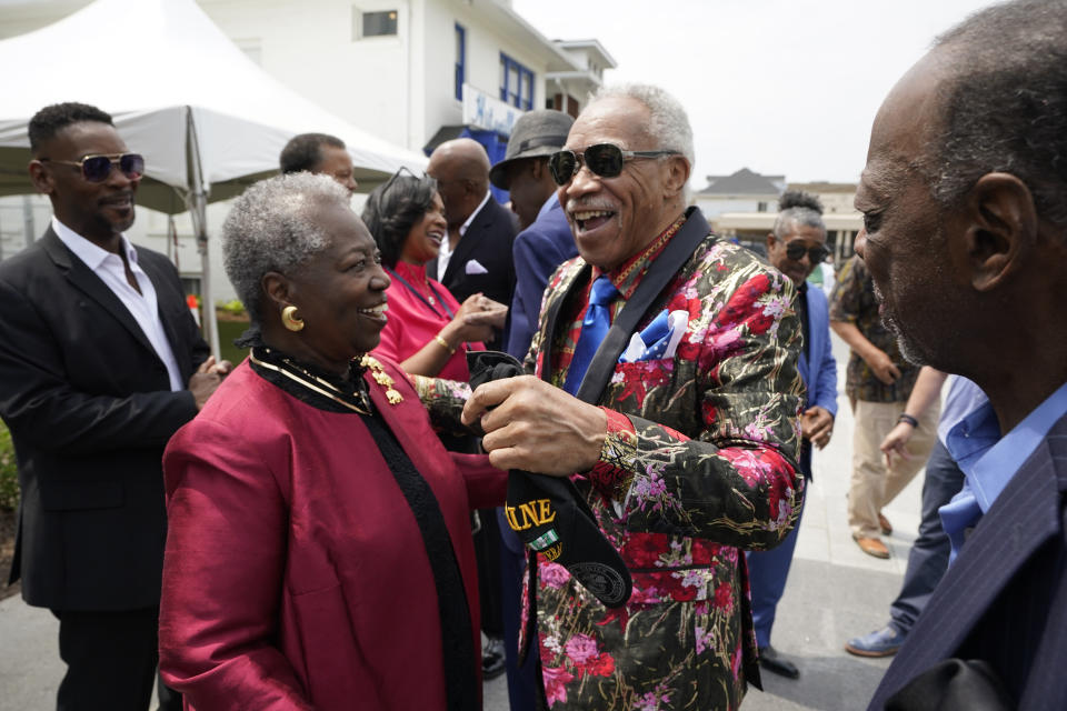 G.C. Cameron of the Spinners greets Norma Fambrough outside the Motown Museum, Friday, May 19, 2023, in Detroit. The museum welcomed the iconic soul group where group members donated uniforms and other memorabilia from their Motown days. (AP Photo/Carlos Osorio)