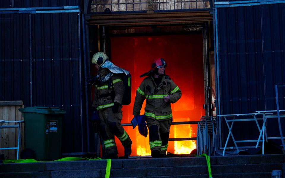 Firefighters work at the scene