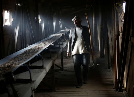 A man works at the Jabal Saraj cement factory in Jabal Saraj, north of Kabul, Afghanistan April 19, 2016. REUTERS/Ahmad Masood