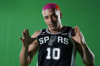 San Antonio Spurs forward Jeremy Sochan (10) poses for photos during the team's NBA basketball Media Day, Monday, Sept. 26, 2022, in San Antonio. (AP Photo/Eric Gay)