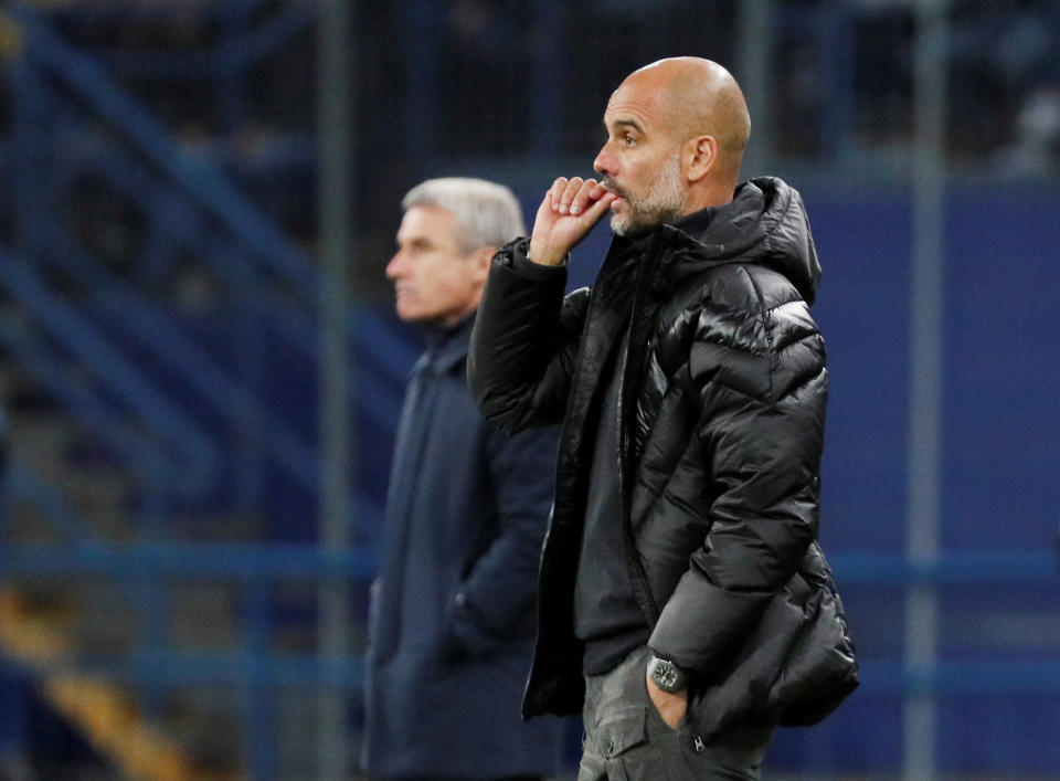 Soccer Football - Champions League - Group C - Shakhtar Donetsk v Manchester City - Metalist Stadium, Kharkiv, Ukraine - September 18, 2019  Manchester City manager Pep Guardiola and Shakhtar Donetsk coach Luis Castro look on  REUTERS/Gleb Garanich