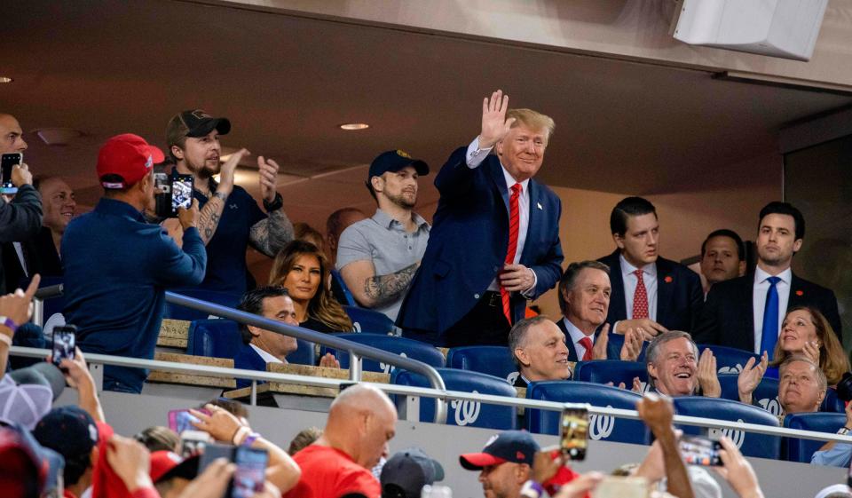 President Donald Trump waves to the crowd at Game Five of the World Series on Oct. 27.