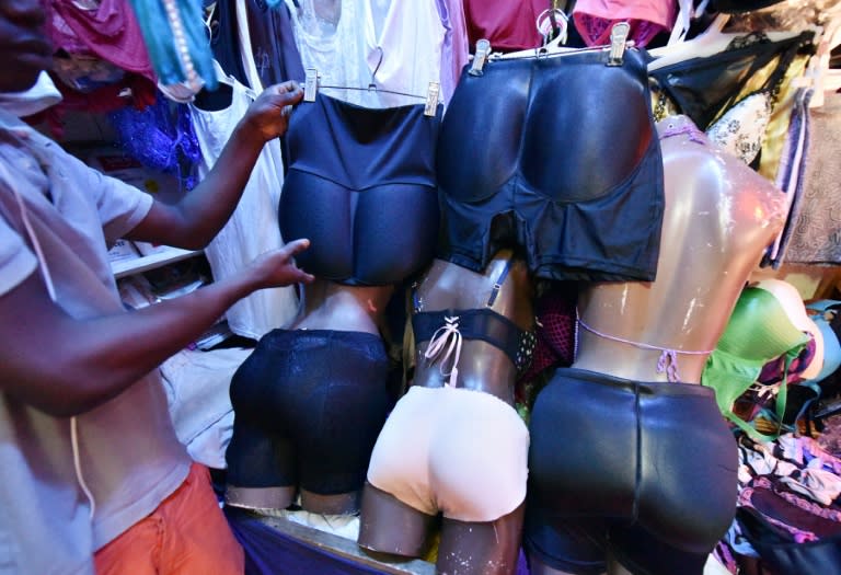 A seller shows off padded panties at a market in Abidjan, Ivory Coast