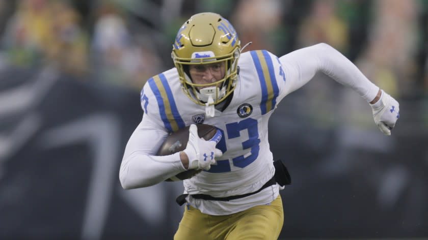 UCLA's Chase Cota runs against Oregon in an NCAA college football game Saturday, Nov. 21, 2020, in Eugene, Ore. (AP Photo/Chris Pietsch)