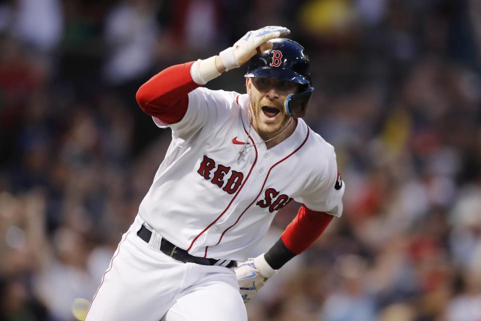 Boston Red Sox's Trevor Story looks to the dugout after hitting a grand slam against the Seattle Mariners during the third inning of a baseball game Friday, May 20, 2022, in Boston. (AP Photo/Michael Dwyer)