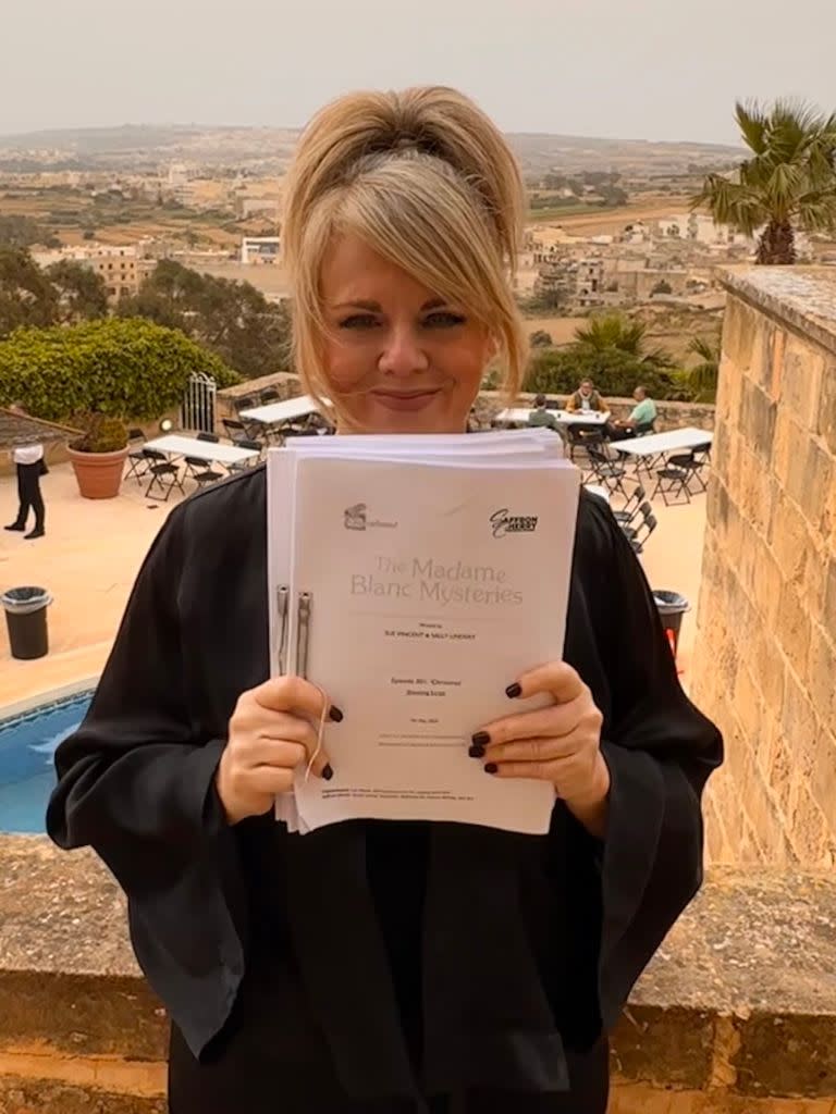 Sally Lindsay holds up scripts on set of series three