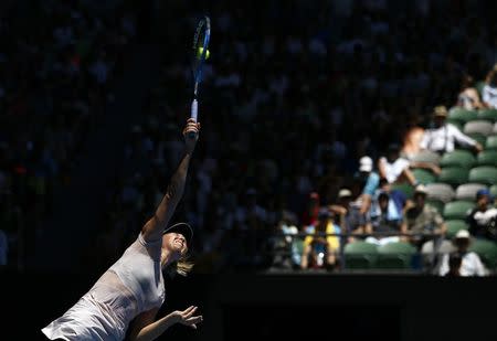 Tennis - Australian Open - Rod Laver Arena, Melbourne, Australia, January 18, 2018. Maria Sharapova of Russia serves against Anastasija Sevastova of Latvia. REUTERS/Thomas Peter