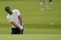 Scottie Scheffler chips to the green on the second hole during a practice round for the PGA Championship golf tournament, Tuesday, May 17, 2022, in Tulsa, Okla. (AP Photo/Eric Gay)