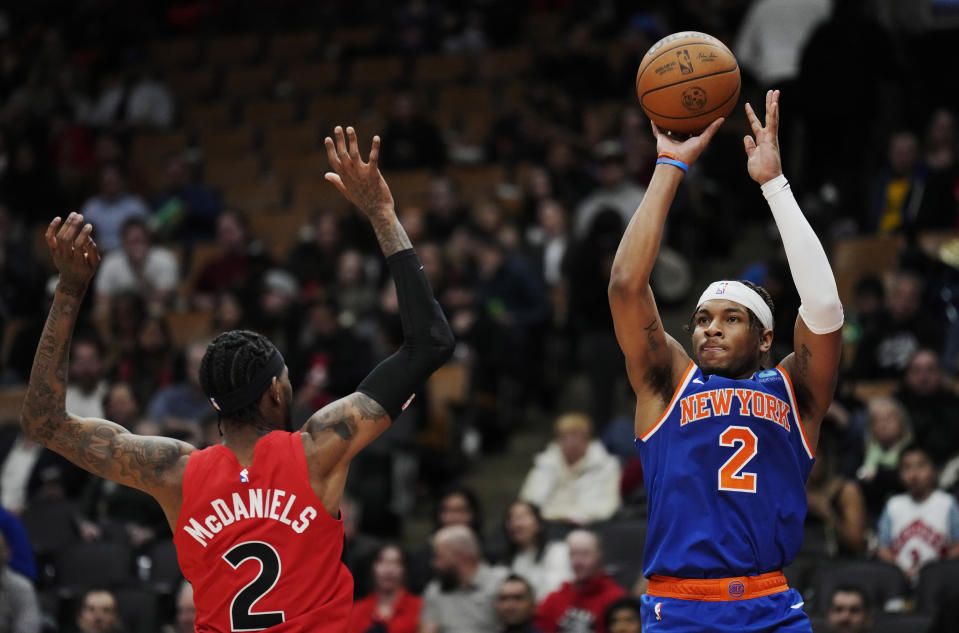 New York Knicks guard Miles McBride shoots over Toronto Raptors forward Jalen McDaniels during the second half of an NBA basketball game Wednesday, March 27, 2024, in Toronto. (Frank Gunn/The Canadian Press via AP)