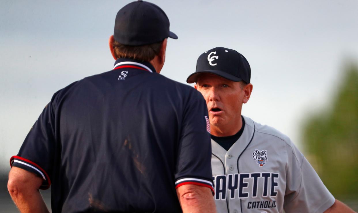 Central Catholic Knights head coach Tim Bordenet talks to the umpire during the IHSAA baseball game against the Twin Lakes, Wednesday, May 8, 2024, at the Twin Lakes High School in Monticello, Ind. Twin Lakes won 5-2.