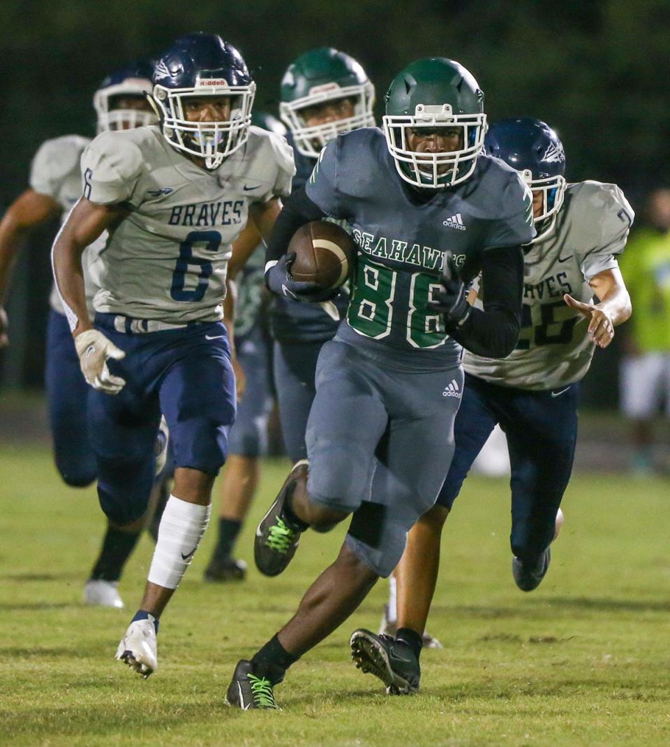 South Waltons Jaden Robinson nearly brings a kickoff back for a score as the Seahawks hosted the Walton Braves in a county rivalry football game.