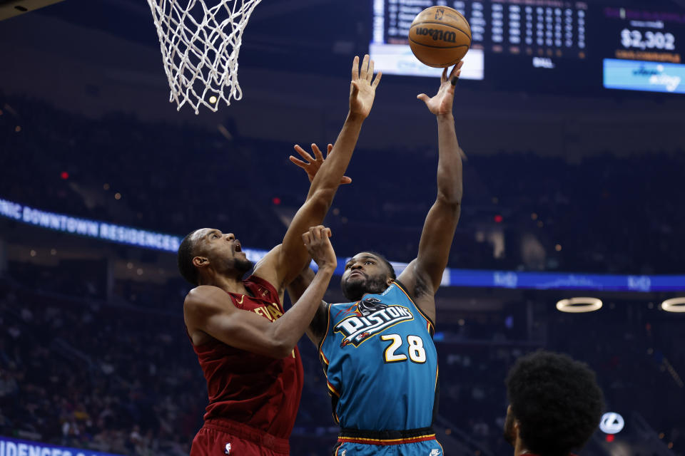 Detroit Pistons center Isaiah Stewart (28) shoots against Cleveland Cavaliers forward Evan Mobley during the first half of an NBA basketball game, Wednesday, Feb. 8, 2023, in Cleveland. (AP Photo/Ron Schwane)