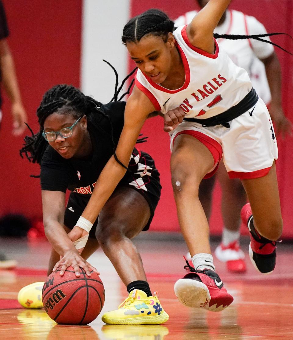 Pearl-Cohn's Erianna Thomas (1) and East Nashville's Emani Wofford (12) battle for a loose ball during the game at East Nashville Magnet High School  Wednesday, Jan. 12, 2022 in Nashville, Tenn.  