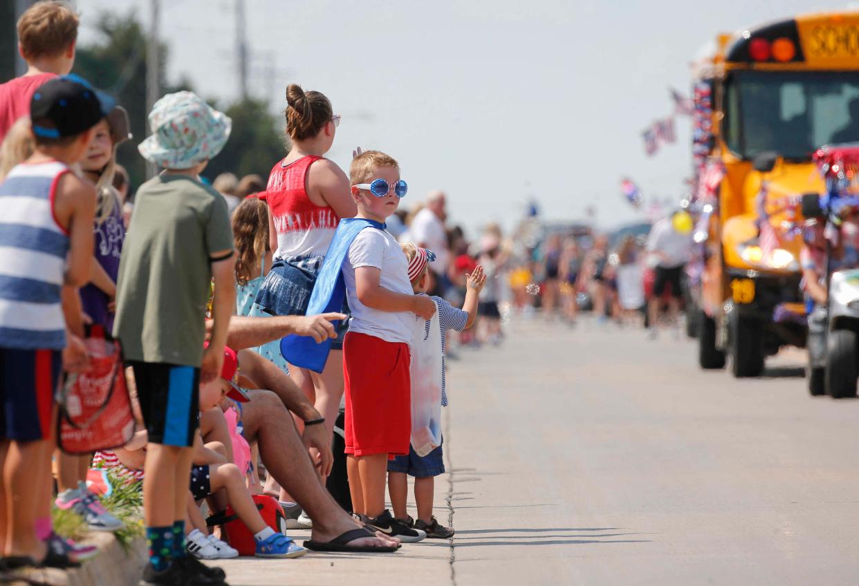 Thousands lined L.A. Grant Parkway in Waukee to celebrate the Fourth of July during the Waukee Celebration of Independence parade on Saturday, July 3, 2021.