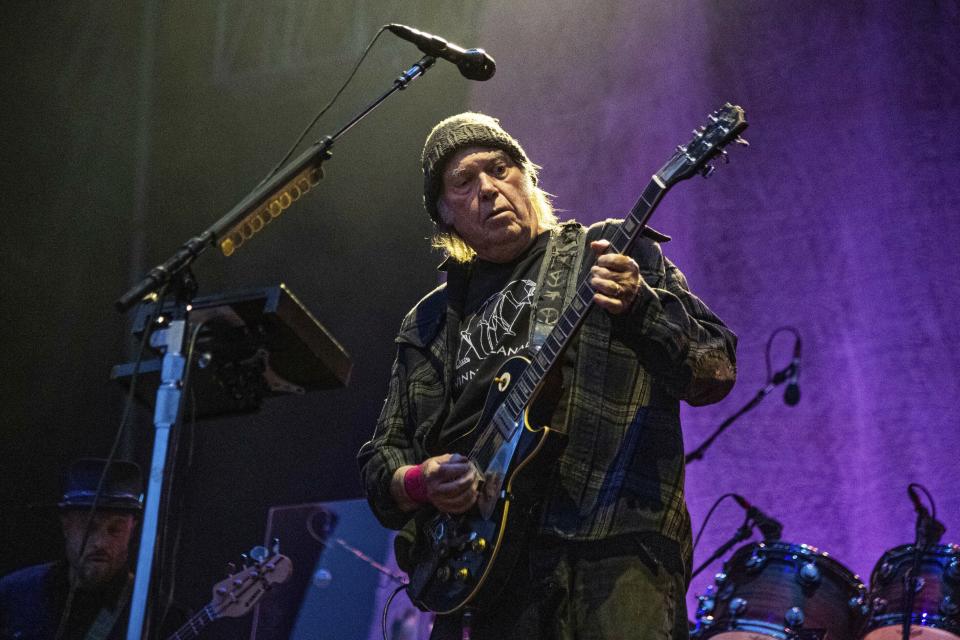 FILE - Neil Young performs at the BottleRock Napa Valley Music Festival at Napa Valley Expo in Napa, Calif. on May 25, 2019. Young is among several musicians who are objecting to their songs being used at President Donald Trump's campaign rallies. (Photo by Amy Harris/Invision/AP, File)